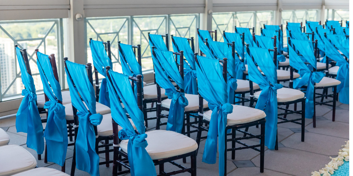 How can banquet chair covers be used to complement table linens and other event decorations?